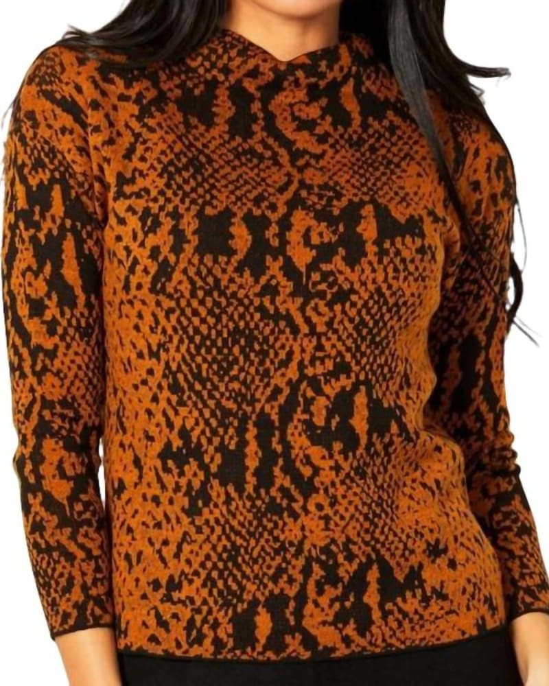 Front of a model wearing a size LG Snake Pattern Funnel Sweater in Rust/Black in Rust/Black by ANGEL. | dia_product_style_image_id:326913